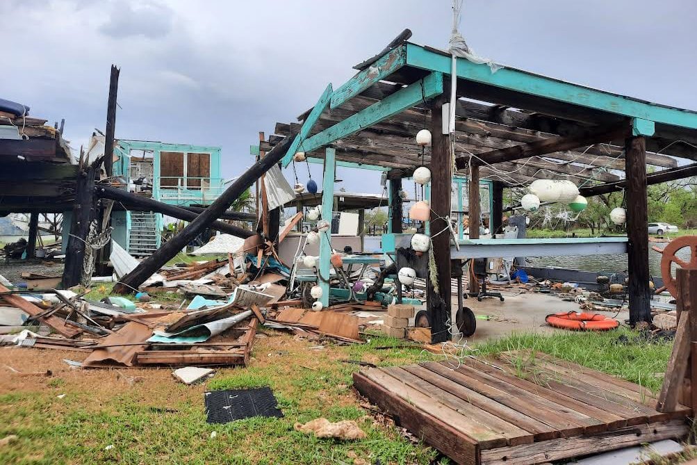 Debris sits outside of Chauvin homes after Hurricane Ida hit Louisiana in 2021. Repeated storms and mounting damage claims have prompted the state of Louisiana to enact a new law that gives insurance companies more flexibility to cancel homeowner insurance policies. Credit: Rachel Mipro/Louisiana Illuminator