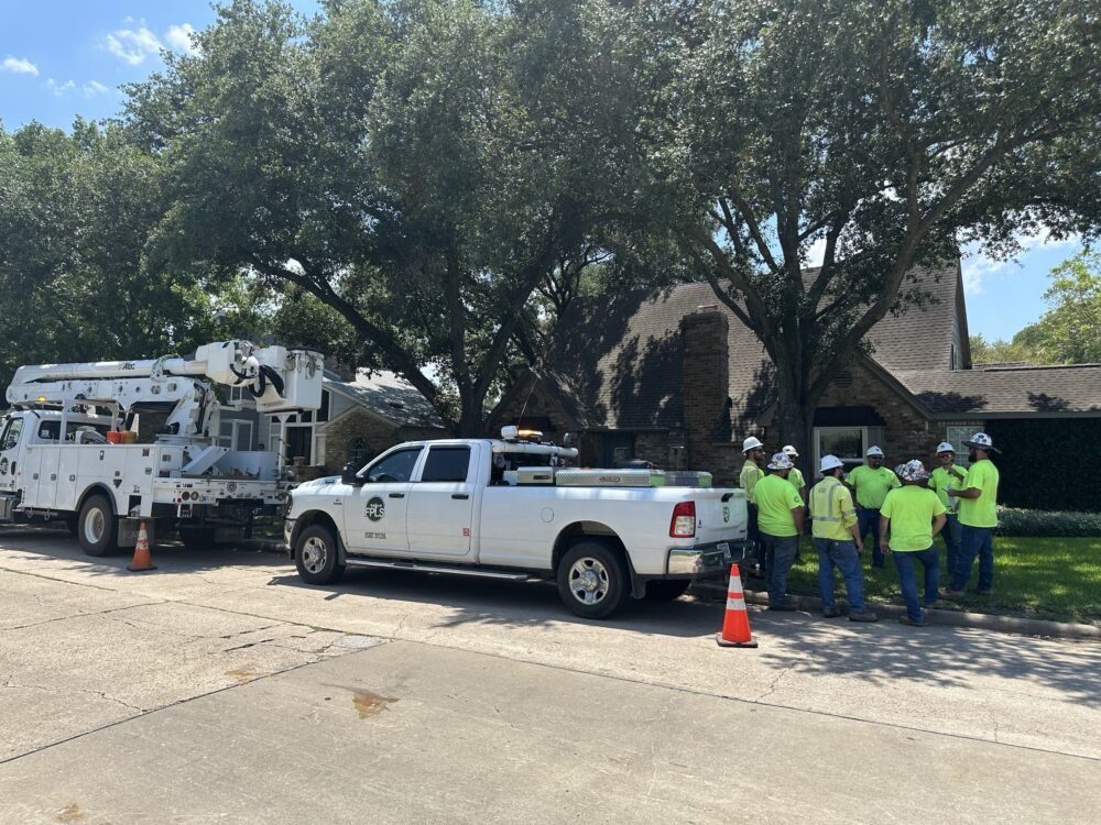 CenterPoint Energy workers and trucks
