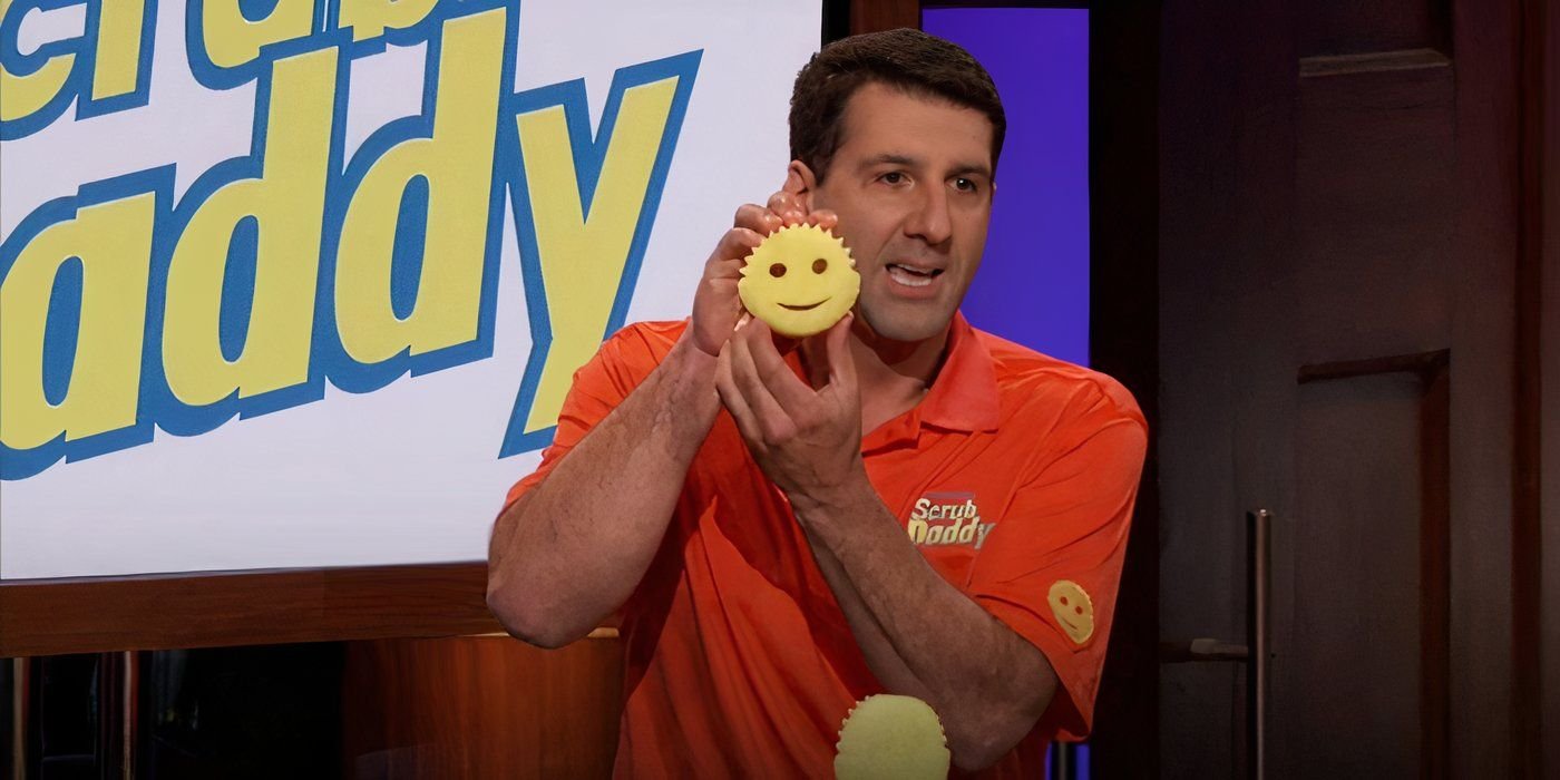 Scrub Daddy owner holding one up, a sign behind him, while pitching on Shark Tank