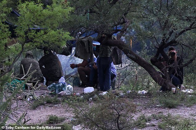 As DailyMail.com looked on to the migrant camps, some there watched backed