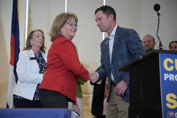 The sponsors of a property tax relief bill, Sen. Chris Hansen, a Denver Democrat, and Sen. Barbara Kirkmeyer, a Brighton Republican, joined Gov. Jared Polis for a bill-signing ceremony at the Boettcher Mansion in Denver on Tuesday, May 14, 2024. (Photo by Hyoung Chang/The Denver Post)