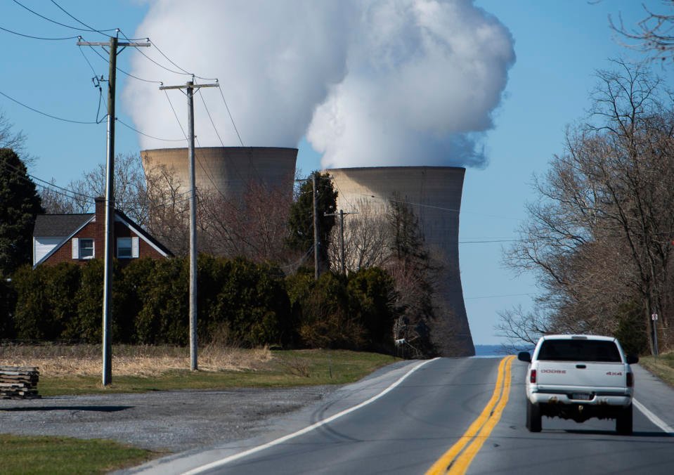 A car drives past the nuclear plant on Three Mile Island, with the operational plant run by Exelon Generation on the right, in Middletown, Pennsylvania on March 26, 2019. (Photo by ANDREW CABALLERO-REYNOLDS / AFP)        (Photo credit should read ANDREW CABALLERO-REYNOLDS/AFP via Getty Images)