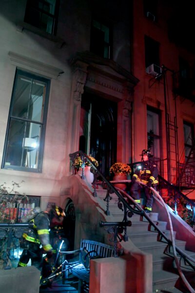 Fire broke out on a setback terrace in the rear of the Henry Street building around 5 a.m. on Sunday, Oct 13, 2024 and spread to the main structure. Photo by Marc A. Hermann