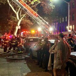 Anxious tenants stand outside as firefighters soak the blaze at 389 DeGraw St. in Carroll Gardens, Brooklyn on Friday, Oct. 11. Photo: Mary Frost, Brooklyn Eagle