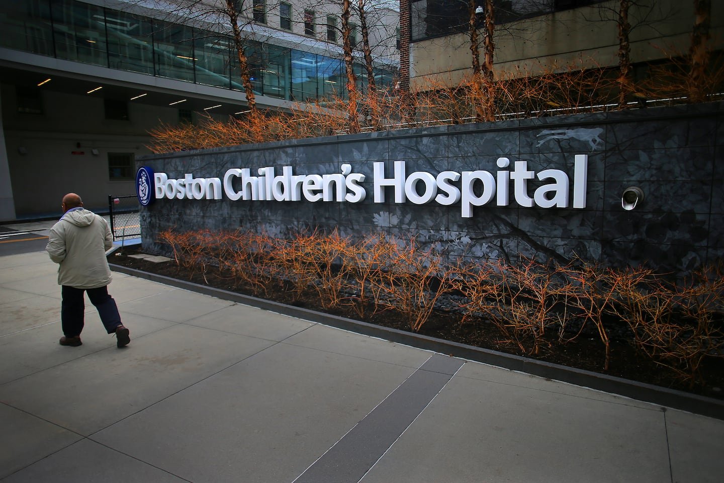 A pedestrian passes the Longwood Avenue exterior of Boston Children's Hospital in 2020.