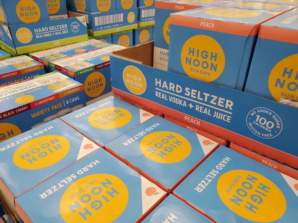 Smith Collection/Gado/Getty Images - PHOTO: Close-up of a stack of containers of High Noon brand hard seltzer, San Ramon, Calif., July 23, 2020.