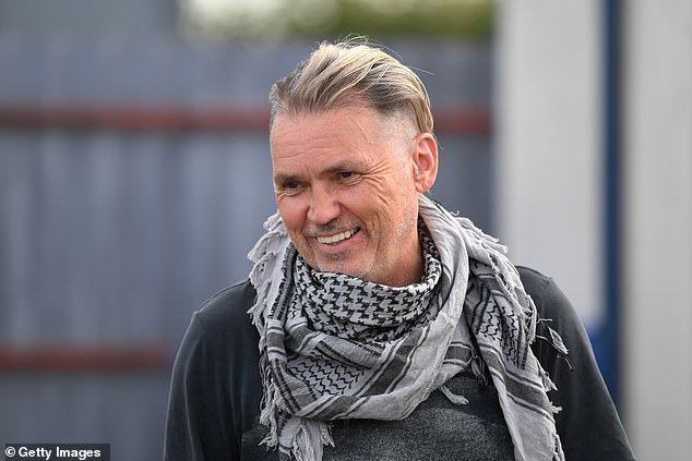 Locals in the town of Stroud in the Cotswolds have demanded Mr Vince (pictured) removes the banner from his office building