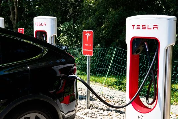 Maienfeld, GR / Switzerland - 30 June, 2019: Tesla Super Charging Station in Maienfeld allowing free charging of all Tesla cars within an hour