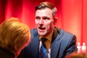 Oregon Attorney General Dan Rayfield speaks to an attendee at a town hall in Phoenix, Arizona on March 5, 2025. (Photo by Jerod MacDonald-Evoy/Arizona Mirror)