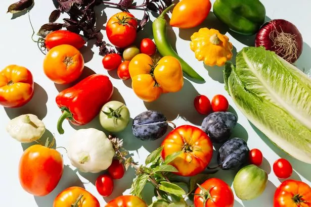 Variety fresh of organic fruits and vegetables on blue background. Healthy food, clean eating, diet and detox concept. Flat lay, top view