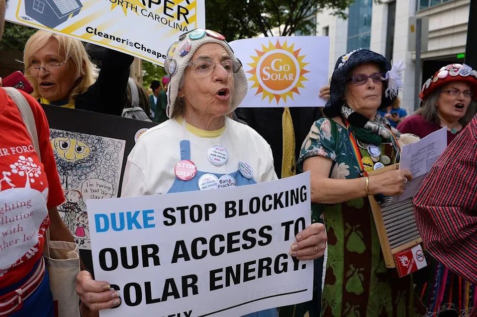 Protestors call out Duke Energy for what they contend are the company’s efforts to block access to solar energy in North Carolina.
