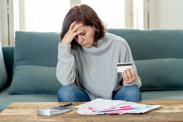 Young woman worried over bills