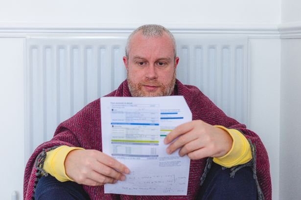 Man looking at his energy bill