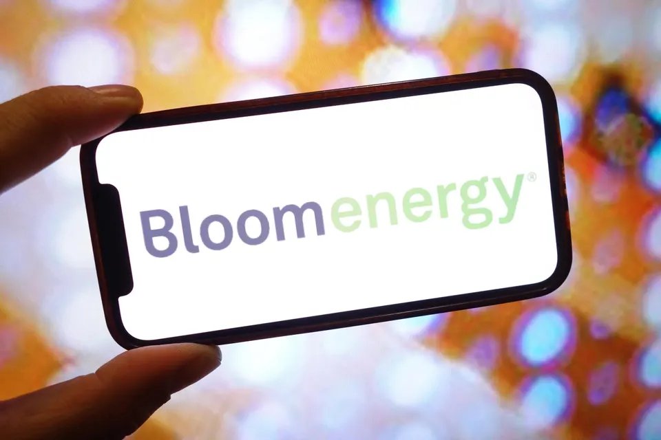 In this photo illustration, a Bloom Energy company logo is...