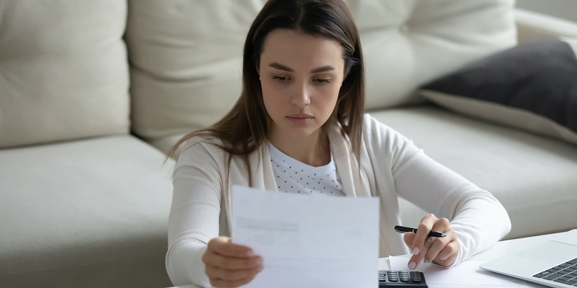 Woman looking at energy bill