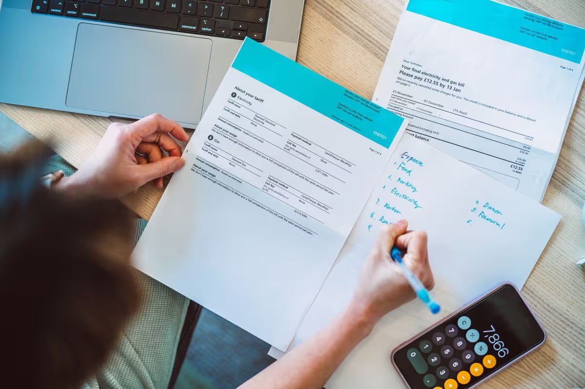 A woman looks at her energy bills
