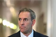 Treasurer Jim Chalmers speaks to journalists in the Press Gallery