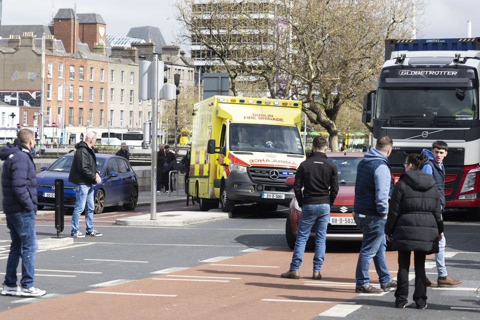 An ambulance makes its way around protesters at a fuel-cost protest in Dublin City centre on Wednesday. Photo: Collins