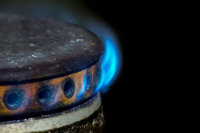 Gas burner on a cooker with blue flames