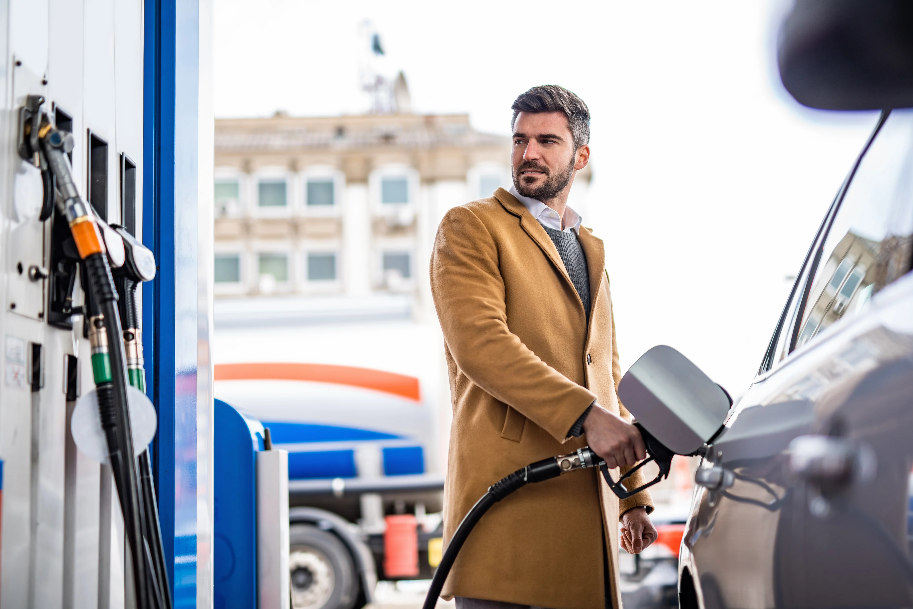 Person pumping gas.