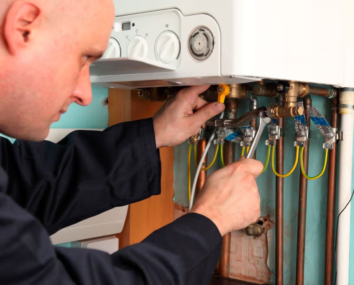 Man installing a boiler (file image)