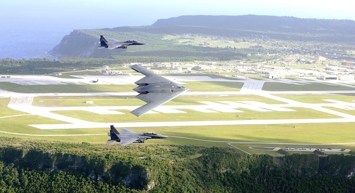 B-2s and an F-15 over Andersen Air Force Base