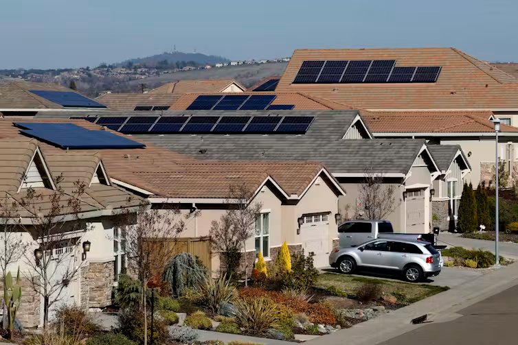 Homes with solar panels on their roofs.