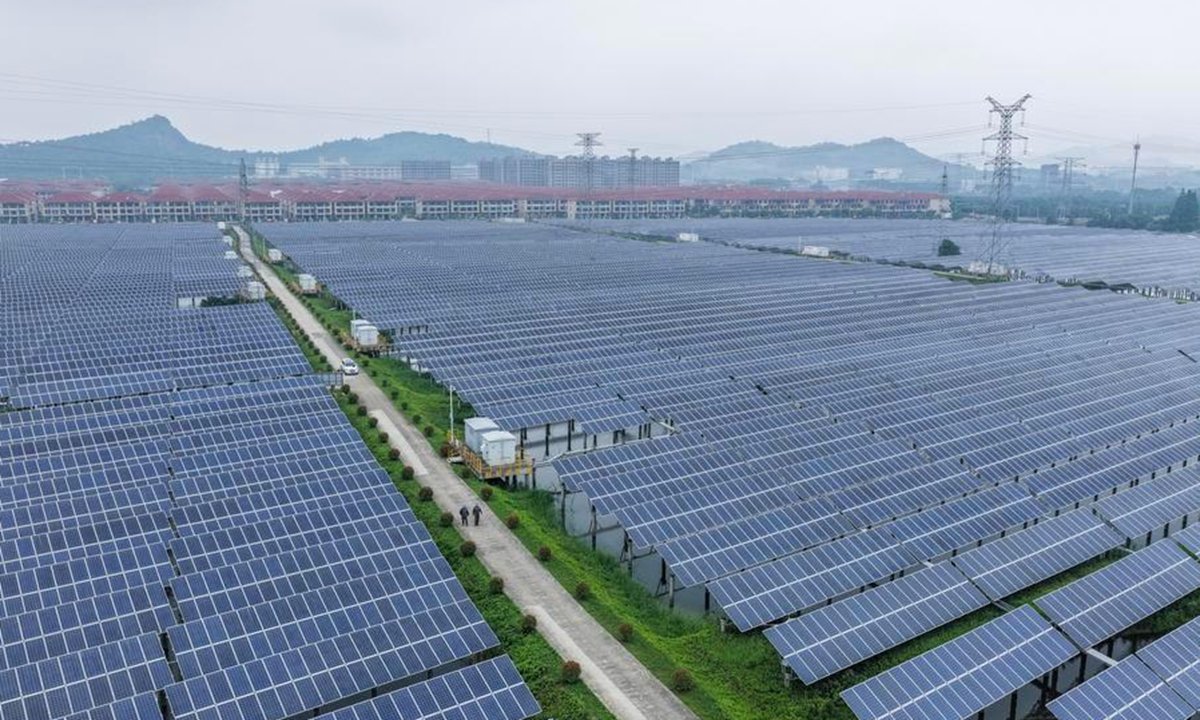A drone photo shows staff members of State Grid Huzhou power supply company conducting inspection on the photovoltaic lines and equipment at a photovoltaic power station in Changxing County of Huzhou City, east China's Zhejiang Province, May 27, 2026. (Xinhua/Xu Yu)